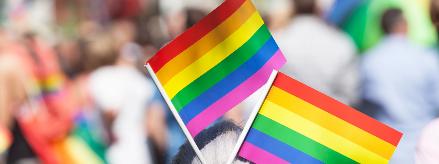 Banner image of a window display sharing positive messages for February