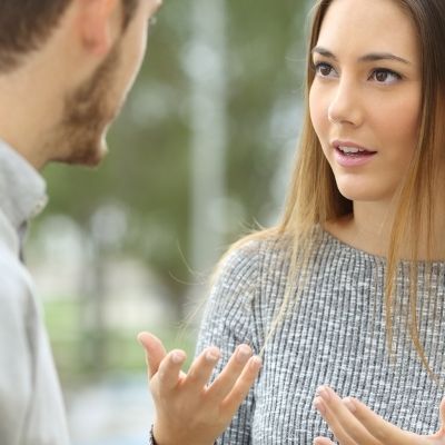 a image of two young people having a conversation