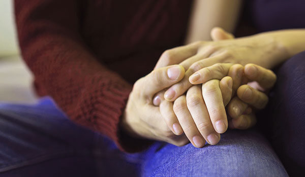 Couple holding hands