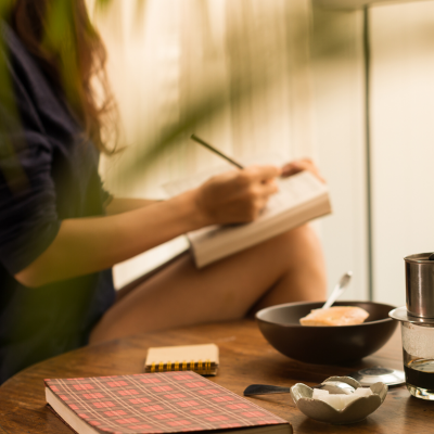 a girl writing in her journal