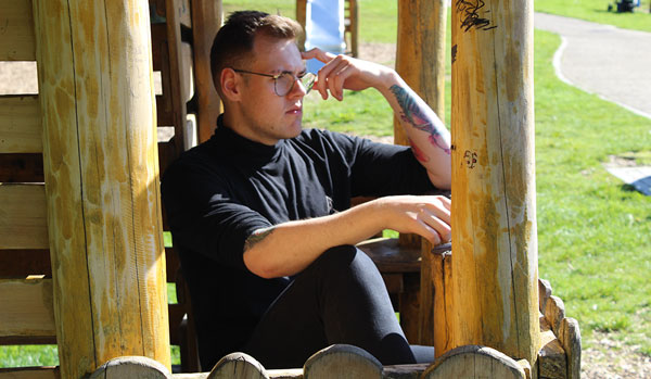 Young man taking some time out in a park