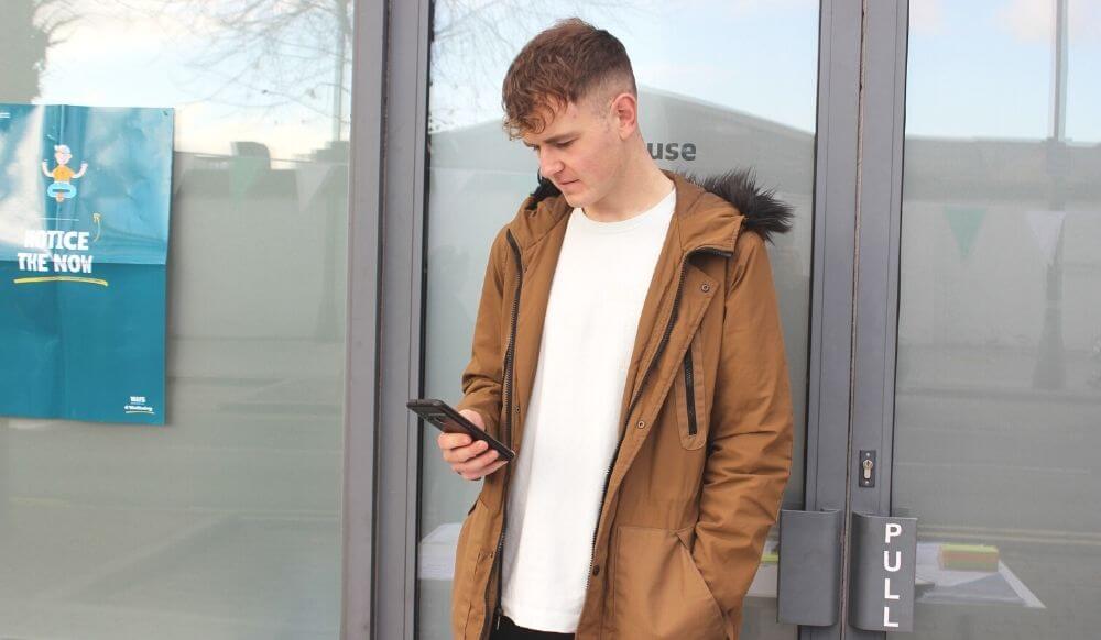 Young man browsing on his phone