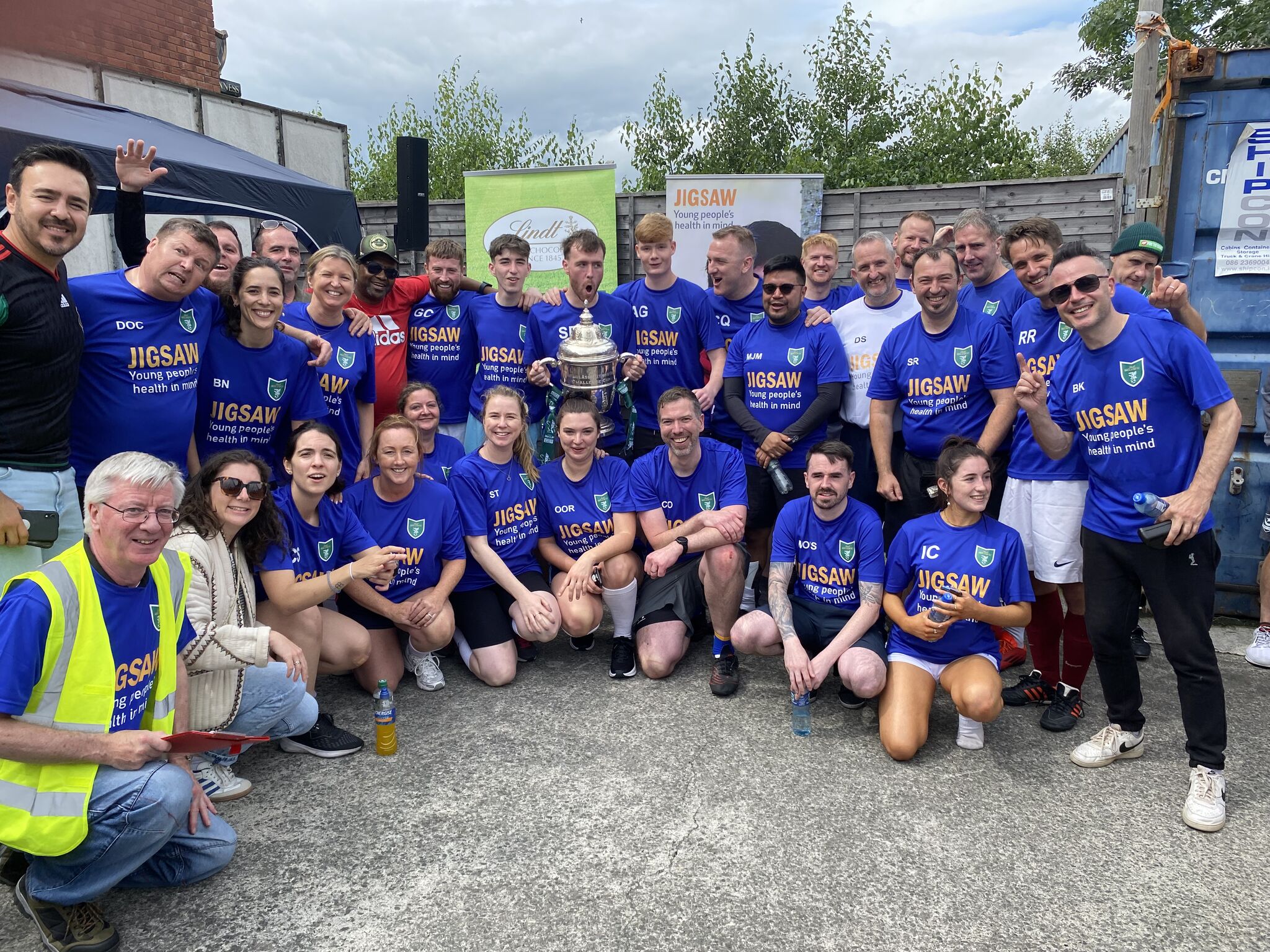 Members of the Lindt Chocolate Ireland Team taking a photo with the FAI trophy at the 2025 Cocoa Cup.